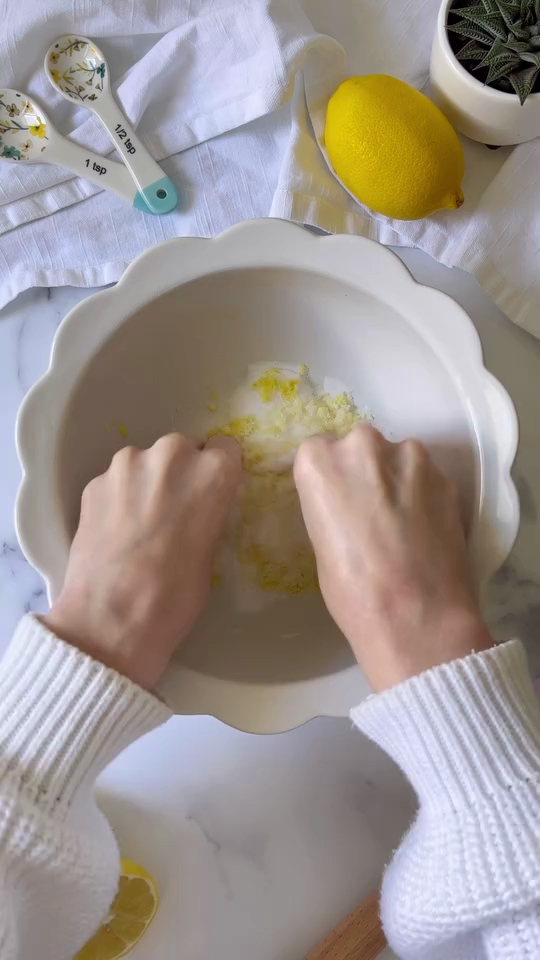 a person's hands in a white bowl