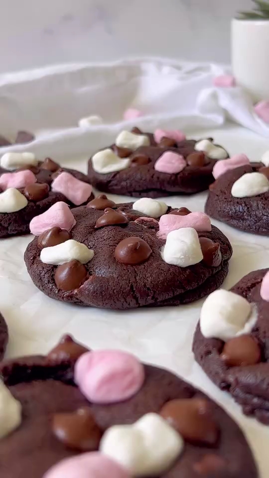 a group of cookies with marshmallows on them